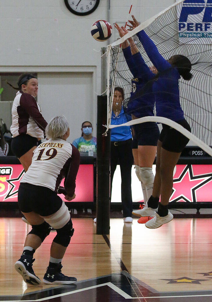Kansas Christian sophomores Lileth Waters, far right, and Daria Korovina, center right, block a pass